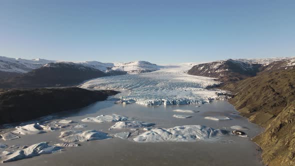 Drone Towards Landscape Towards Lake Of Ice Formations And Glacier