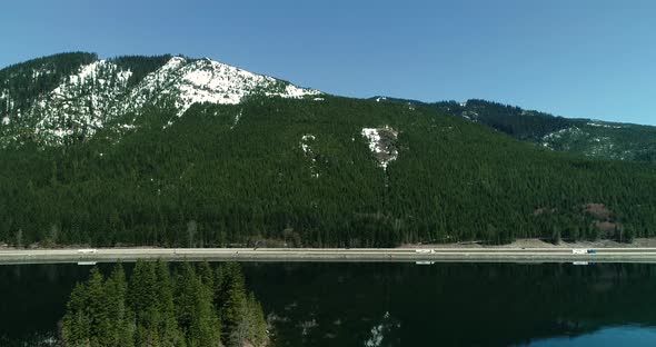 Evergreen Tree Island On Reflective Lake Snoqualmie Pass Interstate 90 Highway Aerial