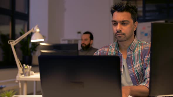 Indian Man with Laptop Working at Night Office 41