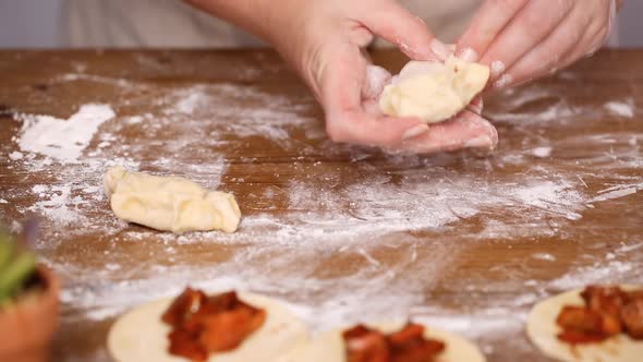 Step by step. Making home made empanadas with red apples fillings.