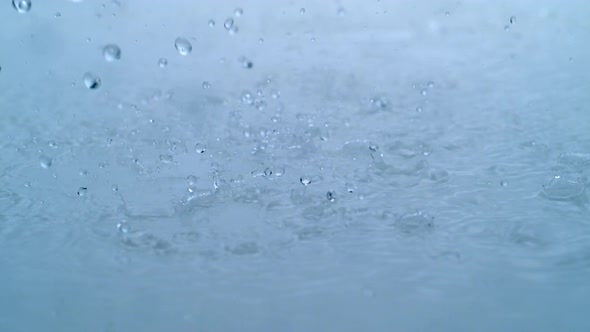 4K 30fps, Heavy rain in puddle, Slow Motion