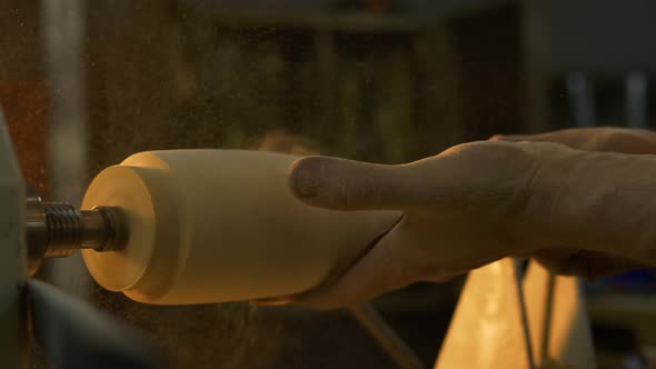 Carpenter Working At Wood Lathe