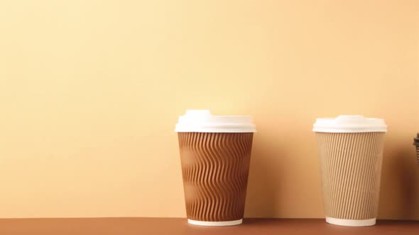 A lot of disposable cups for coffee and tea change places.