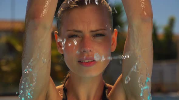 Beautiful Model Scooping Water and Getting Her Head Wet