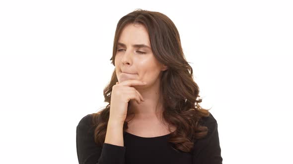 Thoughtful Caucasian Beautiful Female with Long Brunette Hair Standing on White Background in