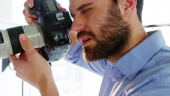 Photographer taking photo with professional digital camera