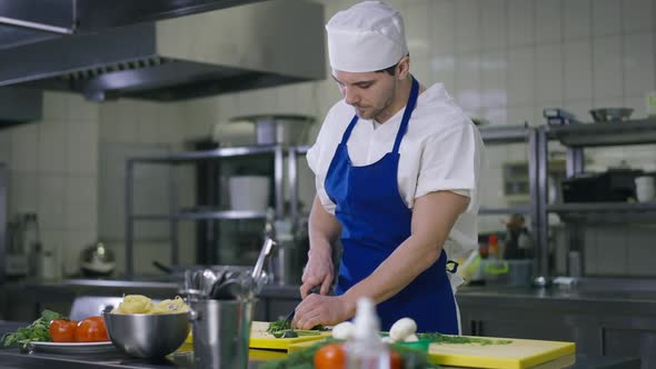 Exhausted Handsome Young Male Cook Cutting Salad Ingredients Wiping Forehead Sighing