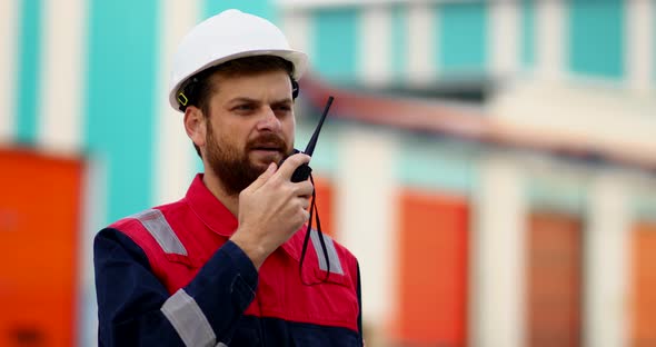 Speaking Engineer Using Radio 