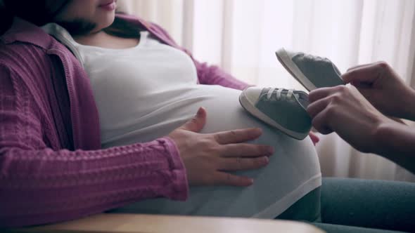 Pregnant Couple Feels Love and Relax at Home