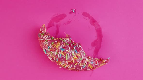 Stop Motion Creative Concept Video Animation Donut Bite on Pink Background.