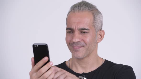 Happy Handsome Persian Man Using Phone