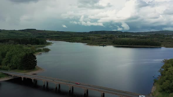 Irish bridge and Liffey river on a cloudy day.