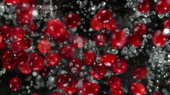 Super Slow Motion Shot of Cranberries and Water Explosion Towards Camera at 1000Fps