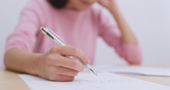 Woman study on her note at home