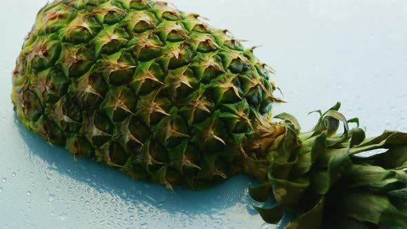 Half of Pineapple on Wooden Table 