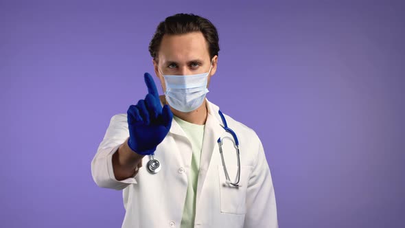 Portrait of Serious Doctor Man Showing Rejecting Gesture By Stop Finger Sign