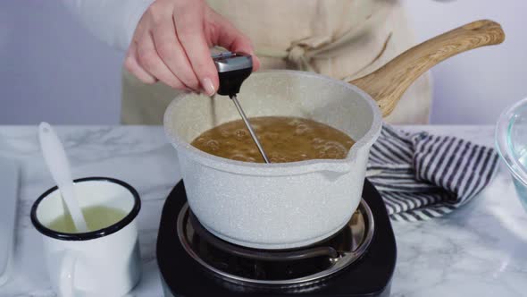 Step by step. Caramelizing sugar in a small cooking pot over the small electric stove