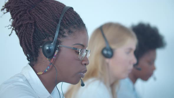 Serious African American Call Center Worker Headset