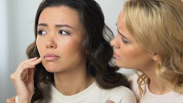 Blonde Woman Comforting and Supporting Her Sad Asian Roommate, Girls Friendship