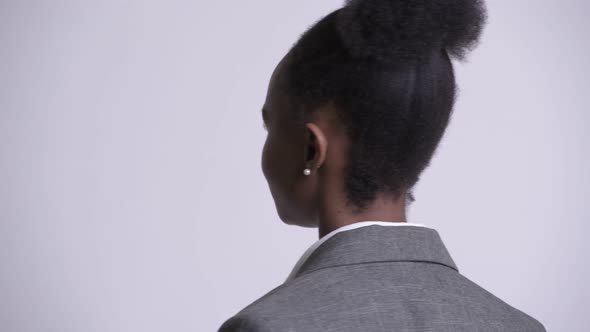 Closeup Rear View of Young Happy African Businesswoman Smiling