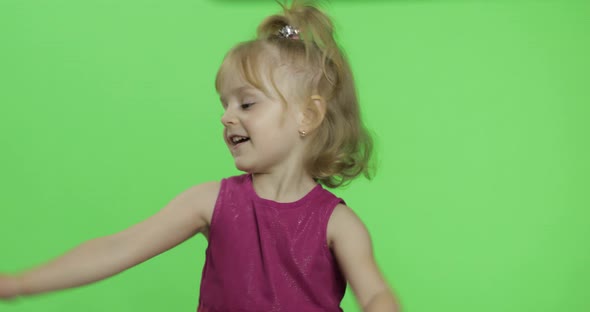 Girl in Purple Dress Dancing. Happy Four Years Old Child. Chroma Key