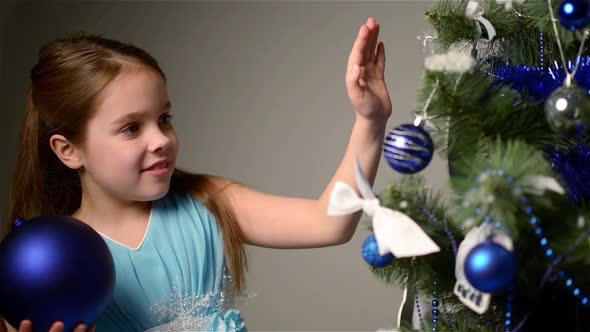 Child Near White Christmas Tree.