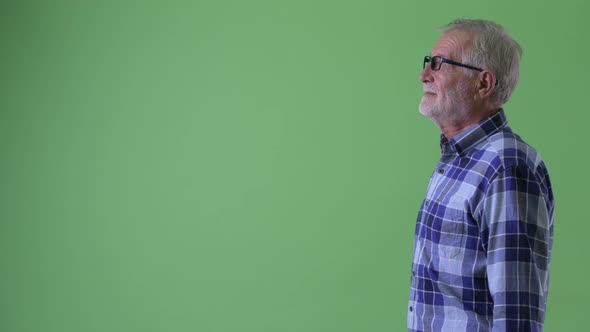 Profile View of Happy Senior Bearded Hipster Man Smiling