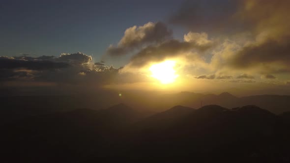 Cloudy Sunset in Mountains