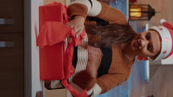 Vertical Video Festive Woman Preparing Gifts with Wrapping Paper