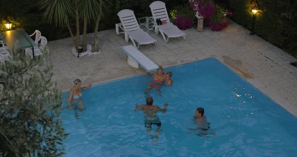 Family spending time in the outdoor pool