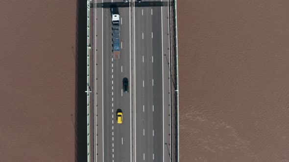 Top down drone shot of busy motorway highway bridge