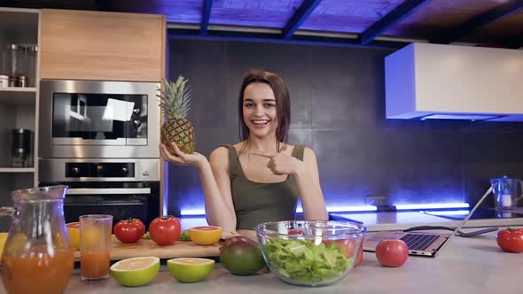 Emotional 25-Aged Brunette Holding Pineapple and Showing Sign "a like" Being