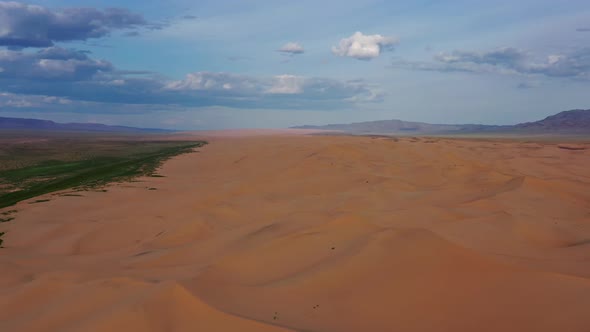 Aerial View of Sand Dunes in Desert at Sunset