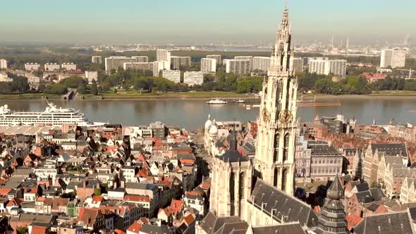 Cathedral of Our Lady , Antwerp, Belgium. Cityscape view and Scheldt River.  Orbiting shot