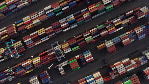 Container Port - Stacked Of Industrial Intermodal Containers With Gantry Cranes. - aerial