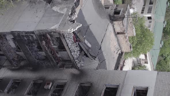 Vertical Video of the Consequences of the War in Ukraine  a Destroyed Building