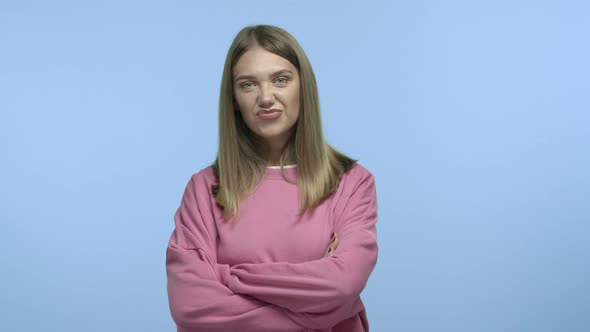 Slow Motion of Annoyed Blond Girl Waiting Impatient with Crossed Arms Place Hands Down and Staring