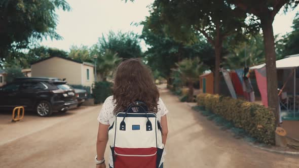 Alone Townswoman Is Walking on Empty Streets of Small Suburban City in Summer