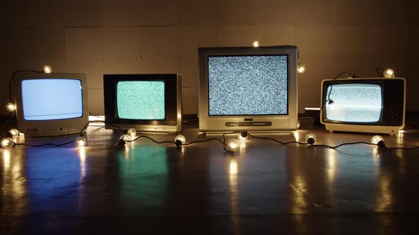 Retro Old Televisions in Darkness