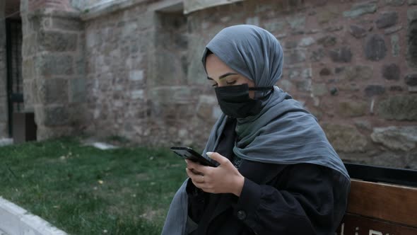 Woman Using Chrome Key Phone