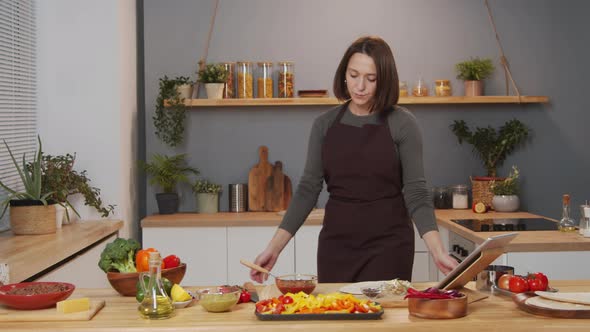 Portrait of Cheerful Woman in Kitchen