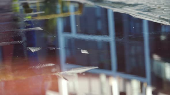 Female Sports Woman Jogging Outdoors Stepping Into Puddle