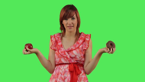 Woman deciding between Doughnut and Apple