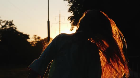 Silhouette of a Girl with Long Hair