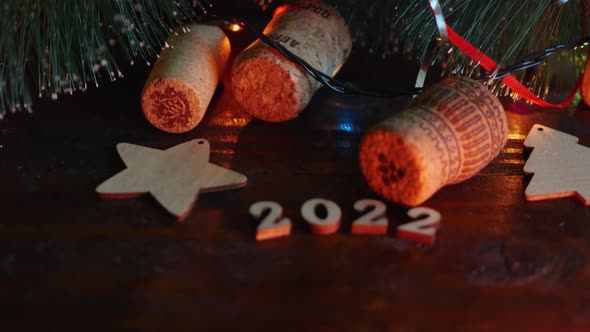 Happy New Year 2022. The camera moves from the top of the Christmas tree with cones, garlands