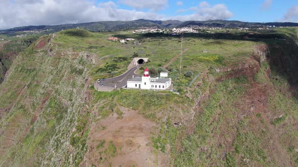 Flying over Ponta do Pargo lighthouse, built on a cliff, Madeira, Portugal