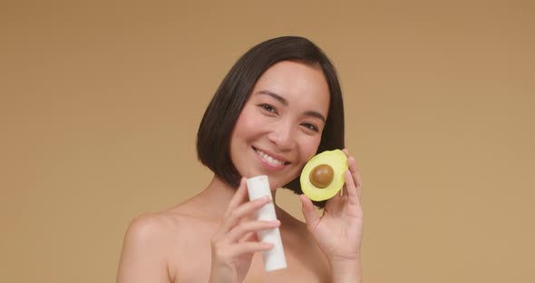 Young Asian Brunette Advertises Cleanser for Clean Face Skin