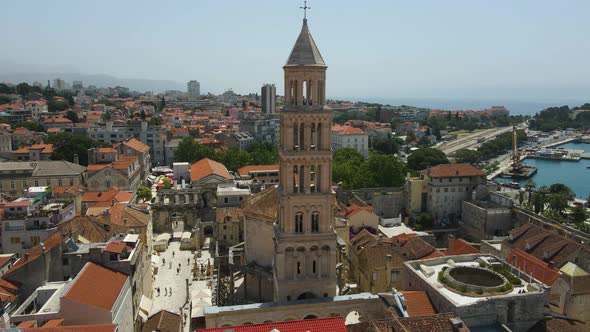 Aerial drone rotating shot of Diocletian's Palace, the bell tower of the cathedral of St Domnius in