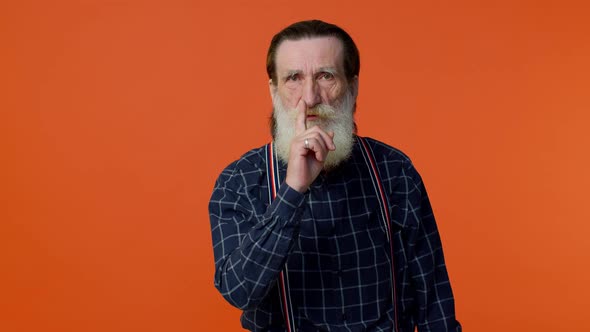 Elderly Bearded Man Presses Index Finger to Lips Makes Silence Gesture Sign Do Not Tells Secret