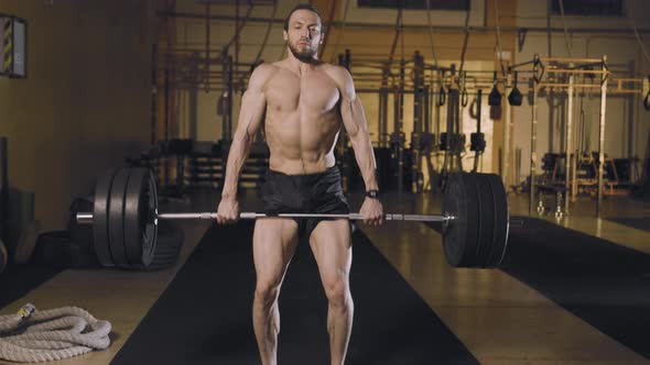 Athletic Man Doing Barbell Snatch